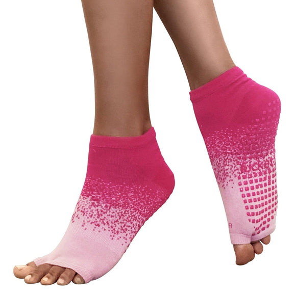 Magenta to light pink ombre anklet style grip socks with magenta grips on the bottom.